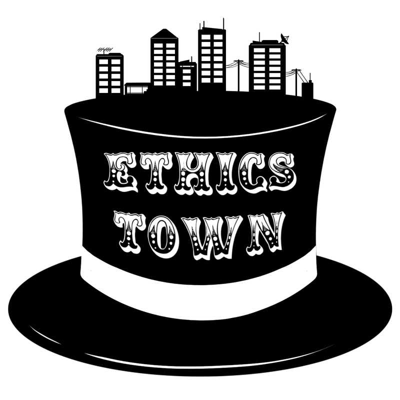 The Ethics Town logo, a black top hat with a city skyline on the top.